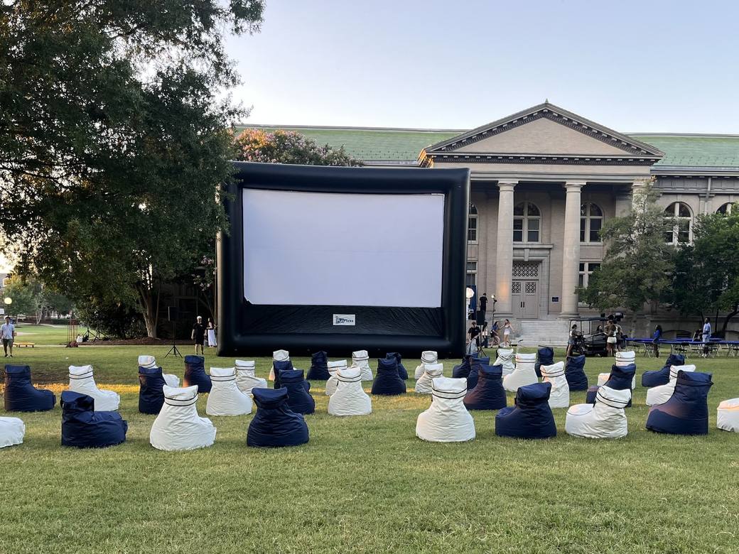 Bean Bag Rental Co navy and white bean bag chairs set up facing an outdoor movie screen on Duke University's East Campus in Durham, North Carolina