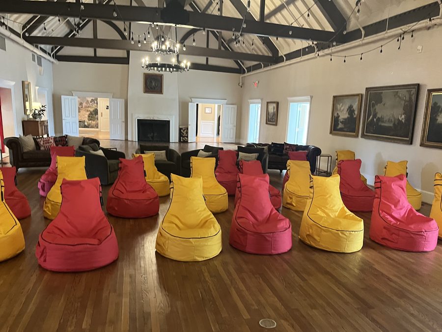 Rows of red and yellow high-back bean bag chairs set up in the ballroom at Hope Valley Country Club in Durham, North Carolina